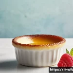 Home 19 크렘브륄레 만드는 법 - A close-up, high-resolution image of a classic crème brûlée dessert served in an elegant white ceram...